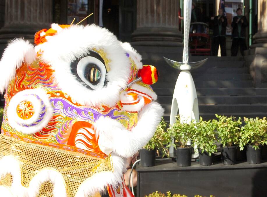 SPORTING LEGACY AT STAKE: A Chinese lion investigates a baton in Bendigo, during a civic function ahead of the 2006 Melbourne Commonwealth Games. Picture: BILL CONROY