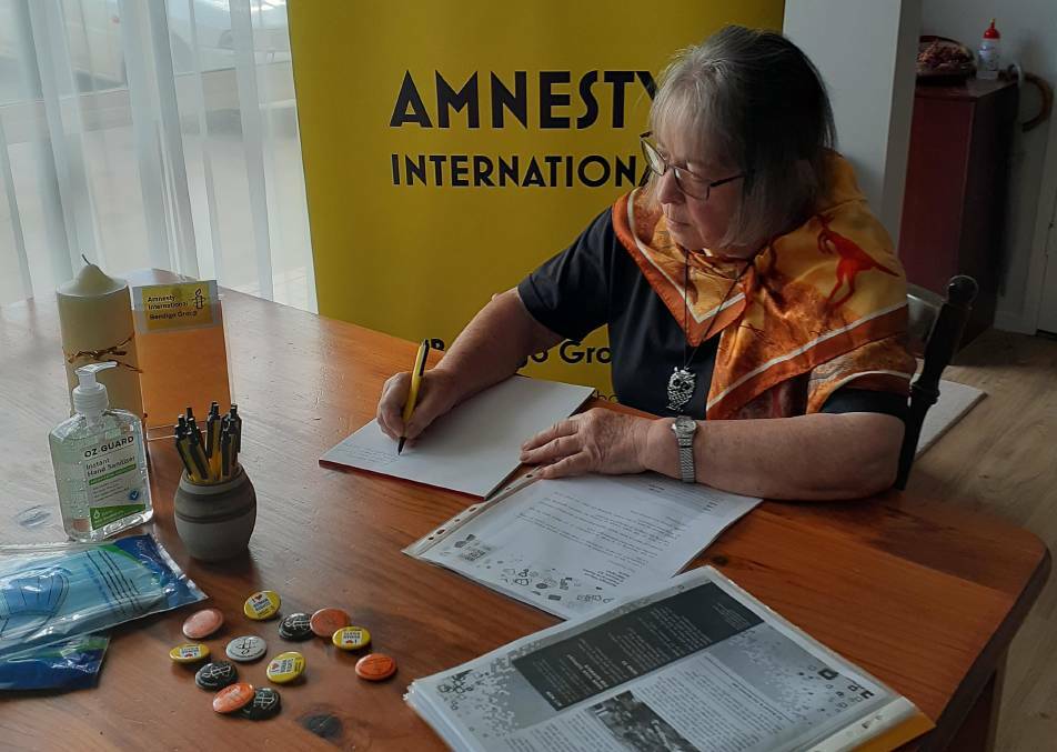 Bendigo Amnesty member Lee Griffiths writes to campaign against human rights abuses. Picture: SUPPLIED