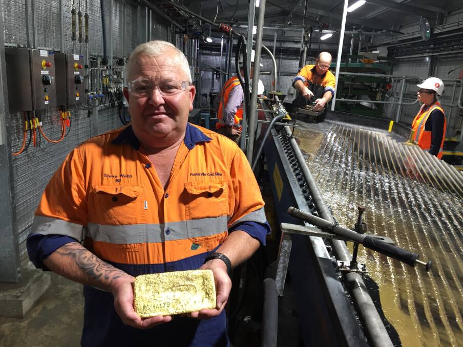 Fosterville Gold Mine gold room supervisor Steve Webb with a 16.5kg gold bar. Depending on the day, the bar could fetch between $950,000 to $1 million on the market.