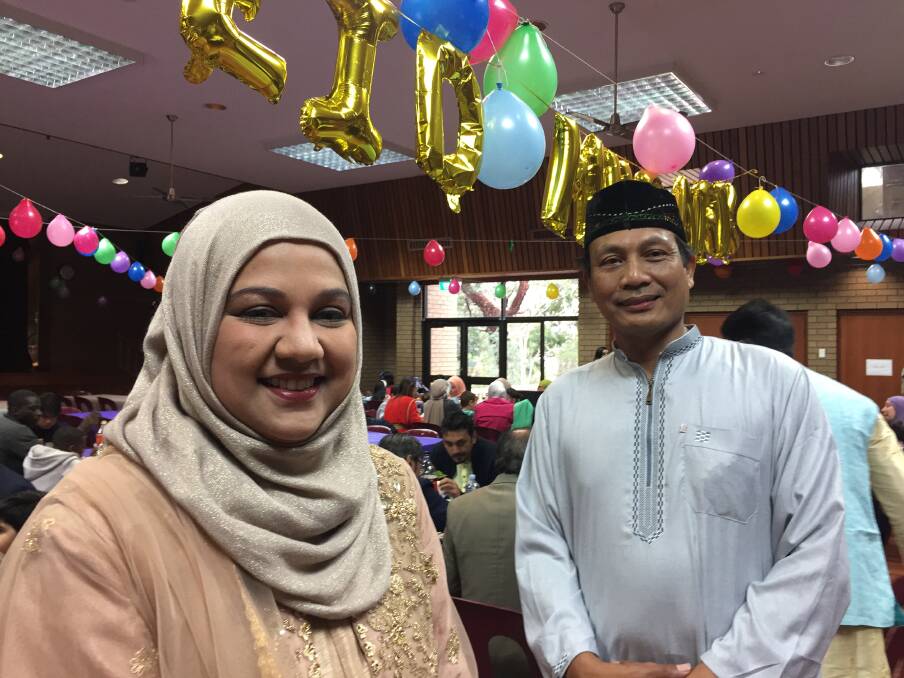 TIME FOR JOY: Aisha Neelam and Heri Febriyanto were among about 250 people celebrating Eid al-Fitr on Thursday. The festivities coincided with the end of Ramadan. Picture: TOM O'CALLAGHAN 