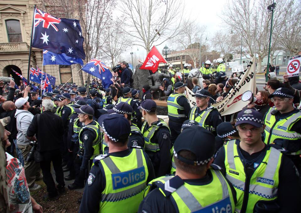 Police form a barrier between right-wing protesters and left-wing counter protesters during demonstrations over the Bendigo Mosque. Picture: GLENN DANIELS