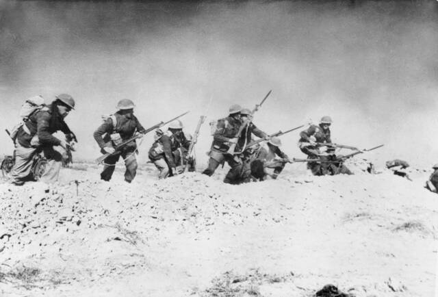 British soldiers leave their trench at Tobruk. Picture: Courtesy of the AUSTRALIAN WAR MEMORIAL