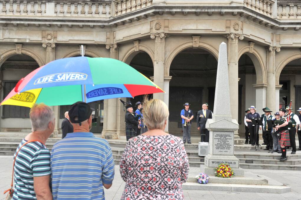 TIME TO FIX: The patchwork of colours on the walls of the Soldiers Memorial Institute can be seen in this photo from a 2015 commemoration service. Picture: NONI HYETT