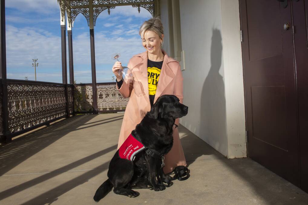 PREPARED: Cancer nurse Jenna Sing and assistance dog Sharlee get ready for Dry July. Picture: DARREN HOWE