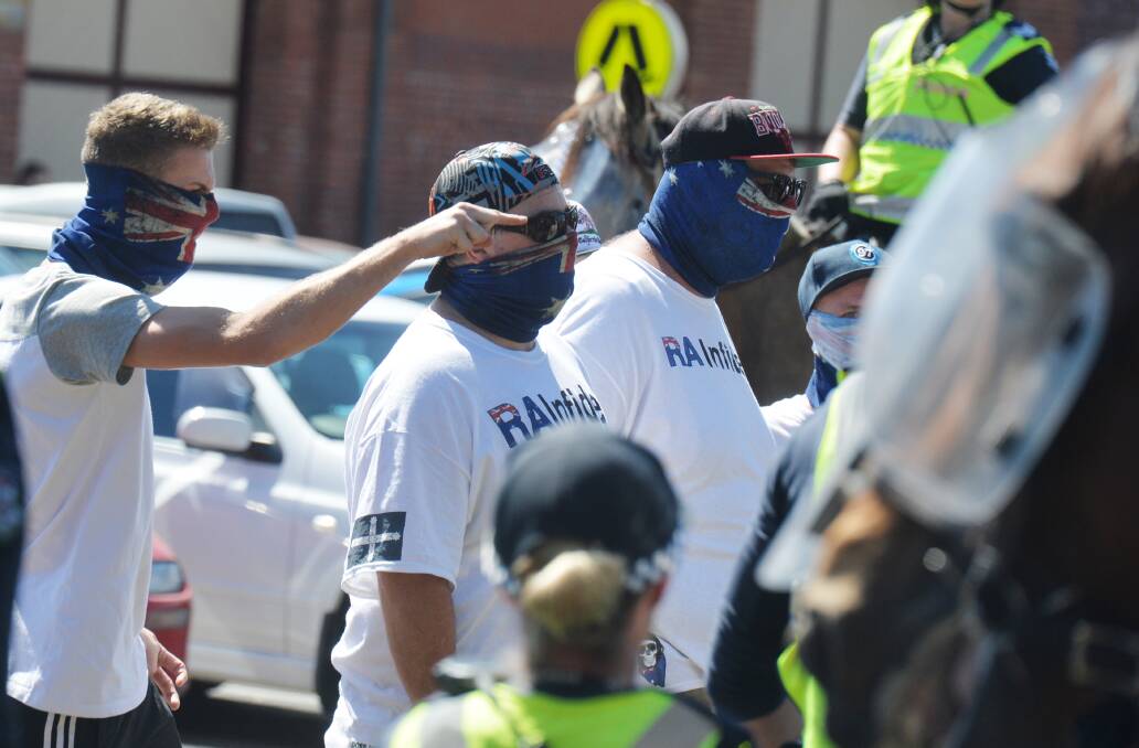Police try to defuse a tense situation in the Bendigo Train Station's car park in 2016, during anti-mosque protests. Picture: DARREN HOWE