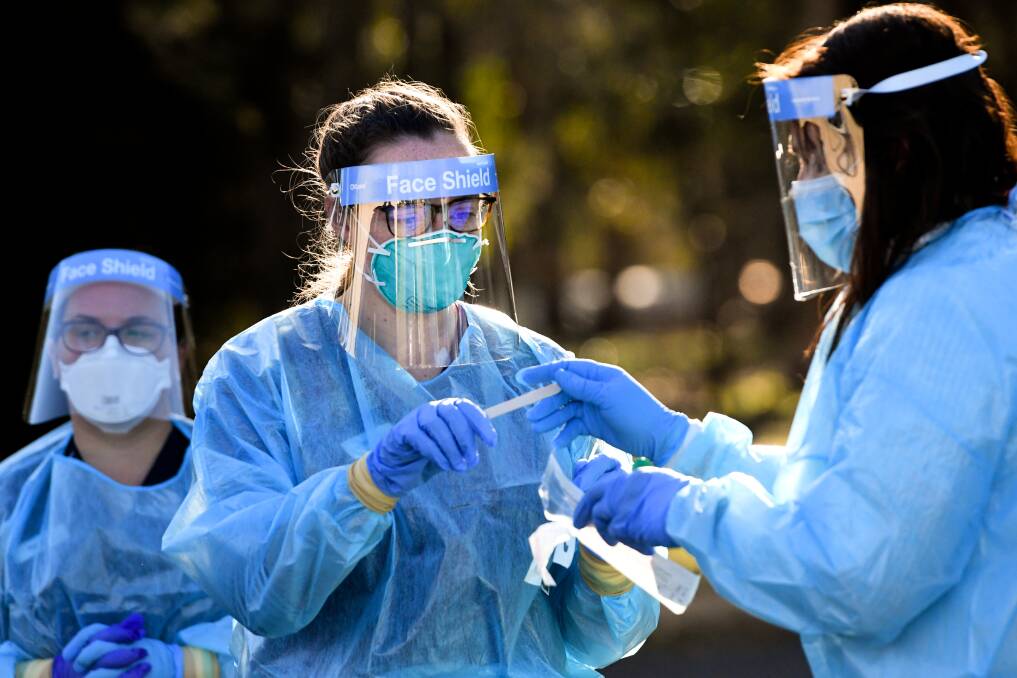 Healthcare workers conduct COVID-19 tests in central Victoria. Picture: NONI HYETT