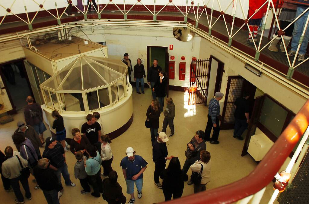Members of the public wander through the prison after it was decommissioned in the mid 2000s.