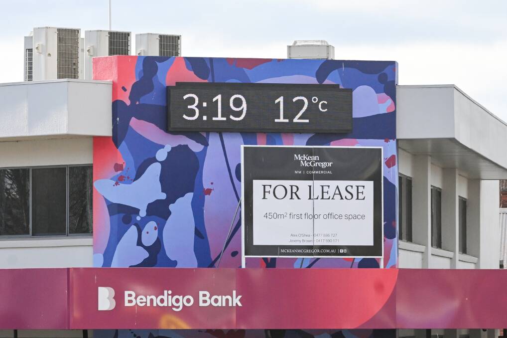 The clock atop a Bendigo Bank branch at the intersection of Mitchell Street and Lyttleton Terrace. Picture by Darren Howe