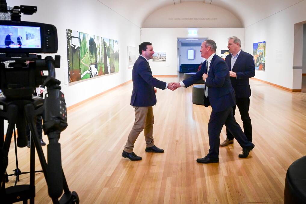 Opposition leader Matthew Guy shakes hands with City of Greater Bendigo chief executive Craig Niemann and shadow minister David Davis at the city's major art gallery. Picture by Brendan McCarthy