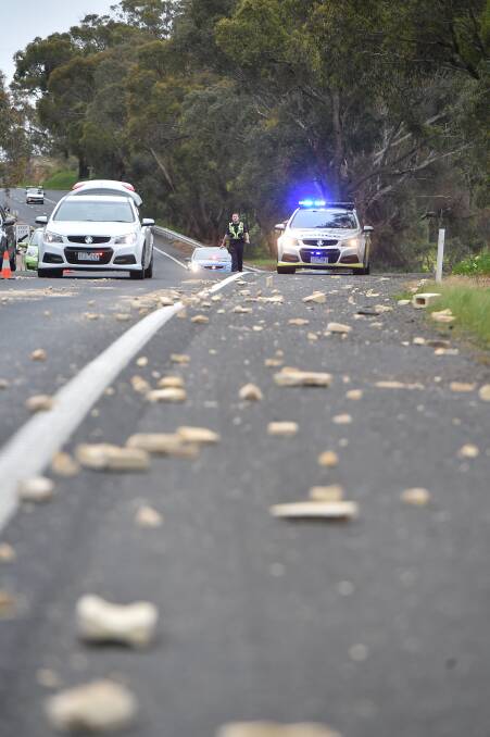 Police attend after bricks fell off a trailer on the Calder Highway near Big Hill in 2016. Picture: NONI HYETT
