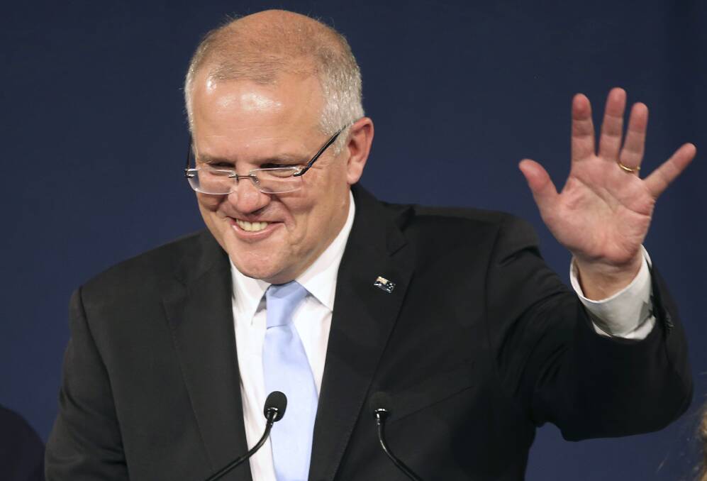 Australian Prime Minister Scott Morrison speaks to party supporters after his opponent concedes defeat in the federal election. Picture: AP Photo/Rick Rycroft