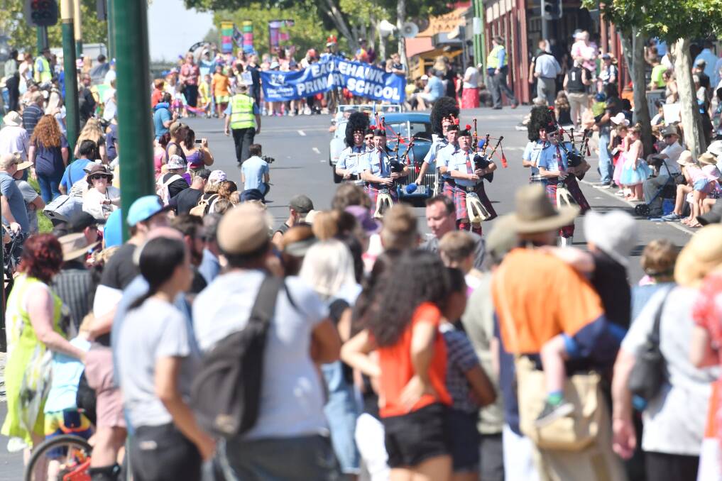 Crowds watch an Eaglehawk street parade during the Dahlia and Arts Festival in 2019. Picture: DARREN HOWE
