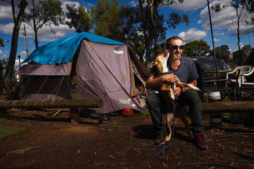 BEST MATES: Adam says he has had to forego some housing opportunities because he won't part with his dog. Picture: DARREN HOWE