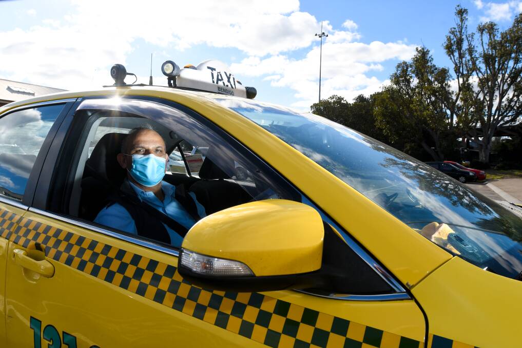 COVERING UP: A Bendigo Taxi driver wears a face mask in Bendigo. Masks are not compulsory in regional Victoria but are being recommended to help stop the spread of coronavirus. Picture: NONI HYETT