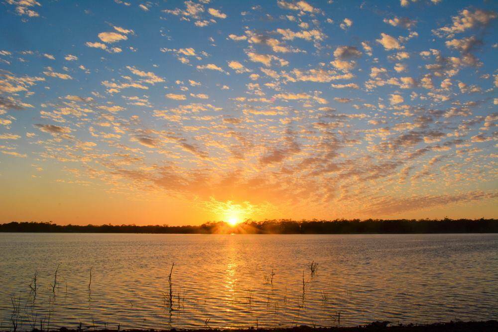 The sun rises at Lake Eppalock. Picture: NONI HYETT