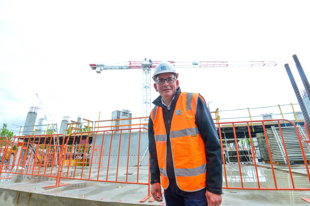 Premier Daniel Andrews at one of the Bendigo building sites promised during the 2018 election, which is now rising. Picture: DARREN HOWE