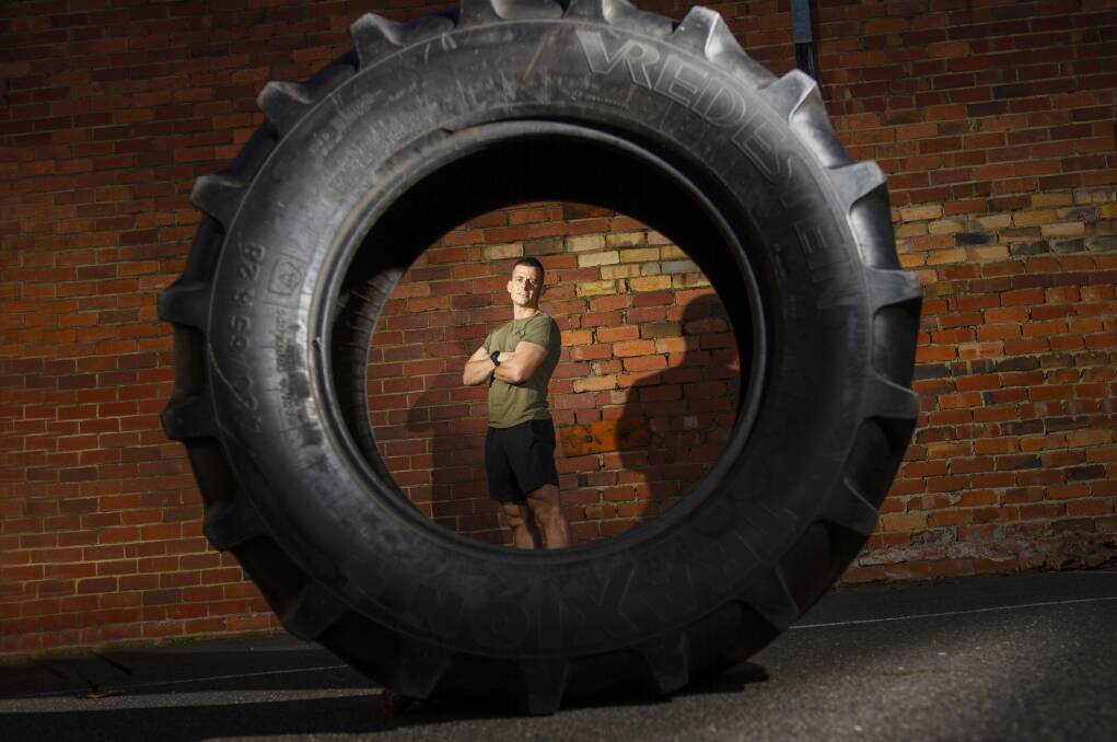 READY TO ROLL: Jayce Bassett is preparing to flip this tyre op One Tree Hill in a four-hour bid to raise awareness over mental health. Picture: DARREN HOWE