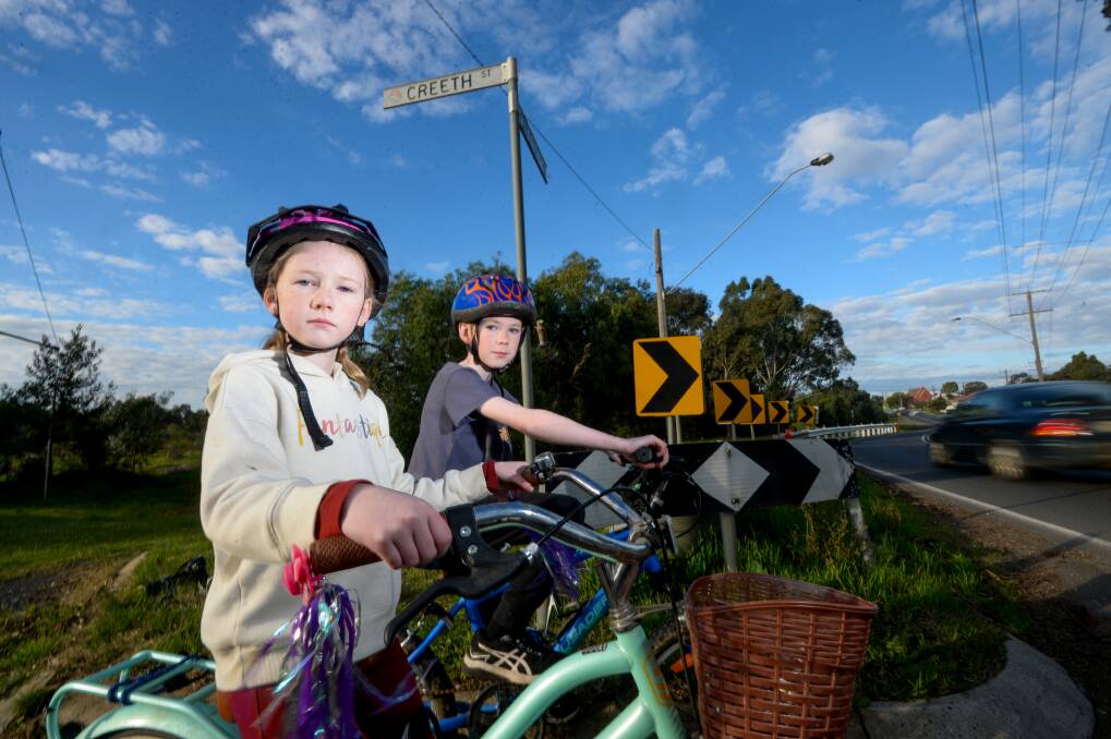 Lily and Oliver Hartland are not allowed to ride to school because their family is worried about them crossing a Long Gully bridge. Picture: DARREN HOWE