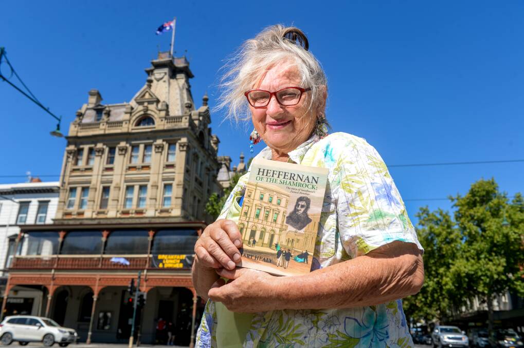 Author Mary Healy with her new book on the first proprietor of the Shamrock Hotel in Bendigo. Picture: DARREN HOWE