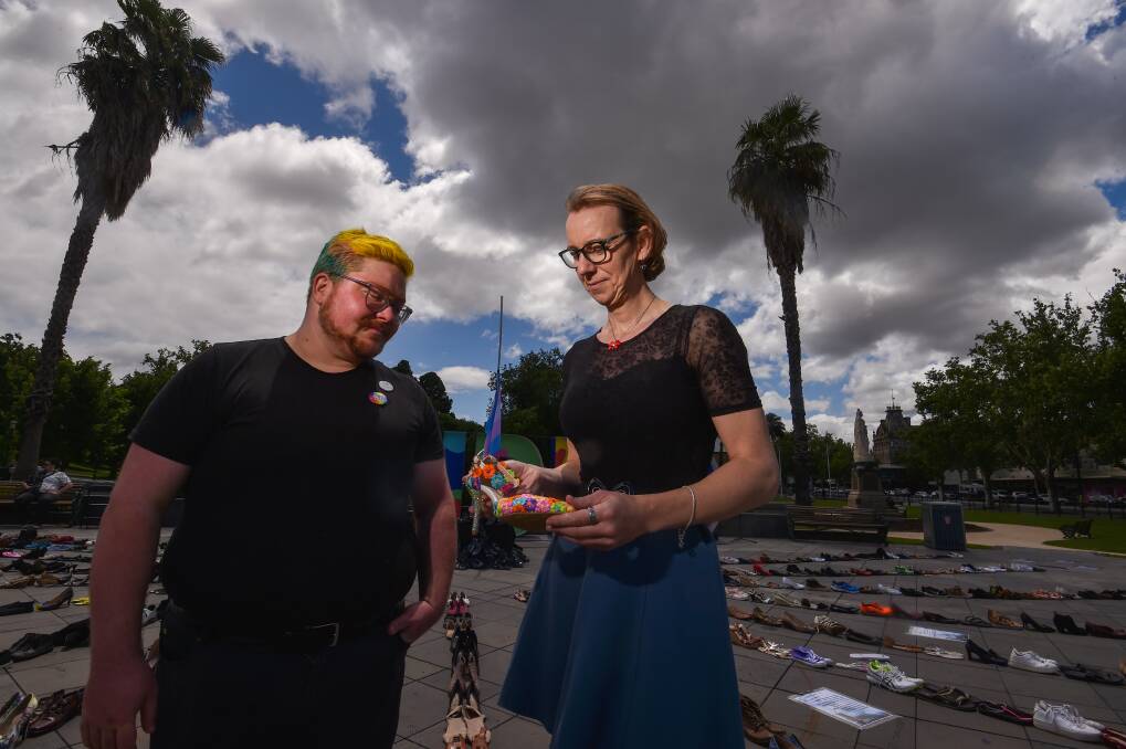 Teddy Transcendent and Zara Jones take a moment to remember those whose lives have been lost in the past year as Bendigo marks Transgender Day of Remembrance. Picture by Darren Howe.