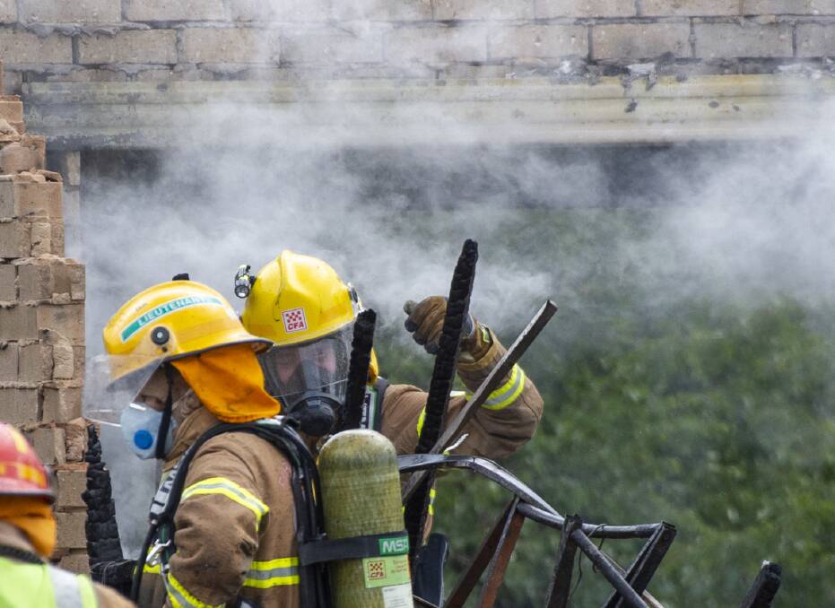 CFA members wearing breathing gear during a fire.