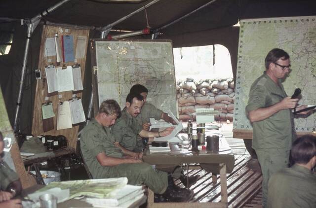 Members of The Royal Australian Artillery's 12 Field Regiment working in an artillery tactical command post tent in June, 1971. Picture courtesy of the Australian War Memorial
