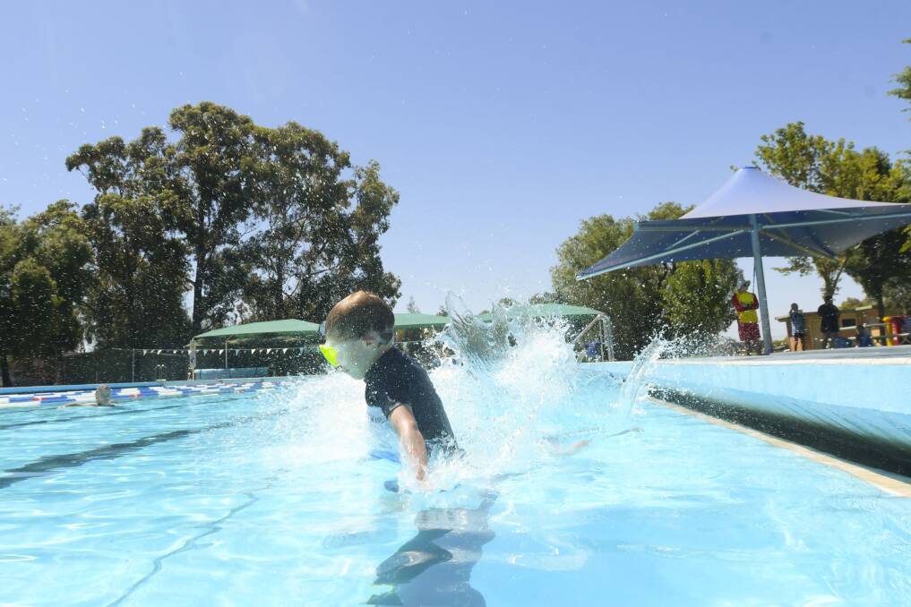 Jackson Arends cools down during one of January's heatwaves. Picture: NONI HYETT