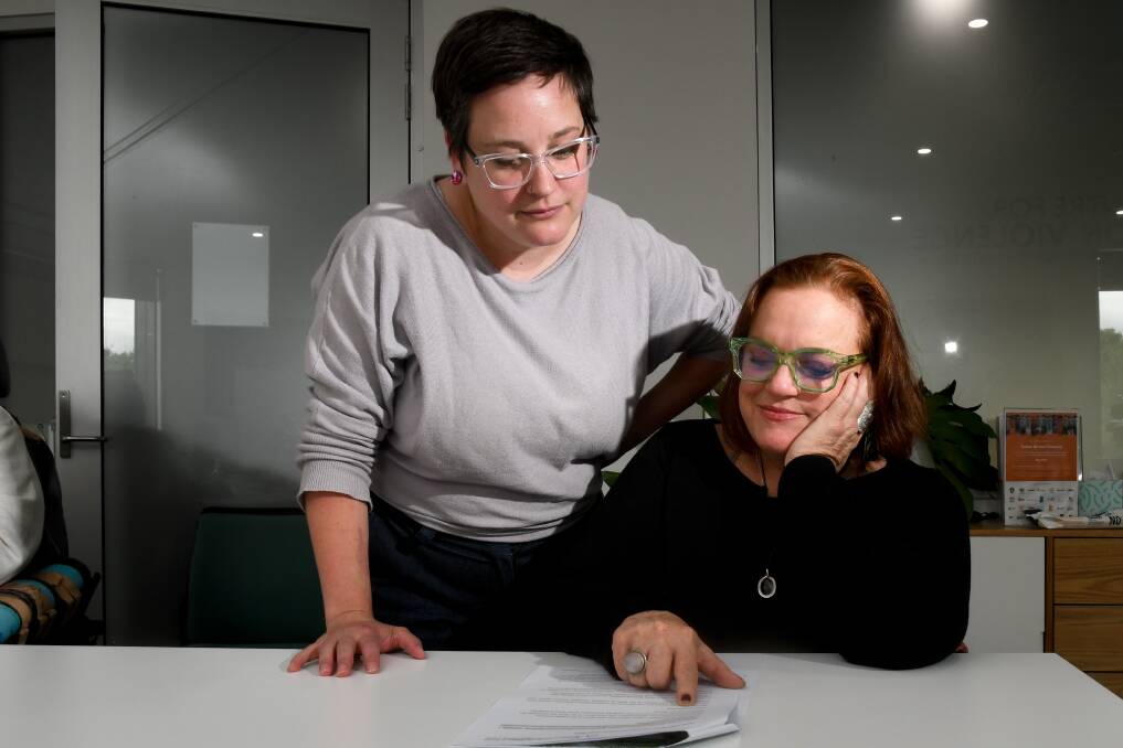 Women with Disabilities Bendigo hub advocates Emma Klemm and Lou Games working in November on a submission for a federal inquiry. Picture by Nonie Hyett.