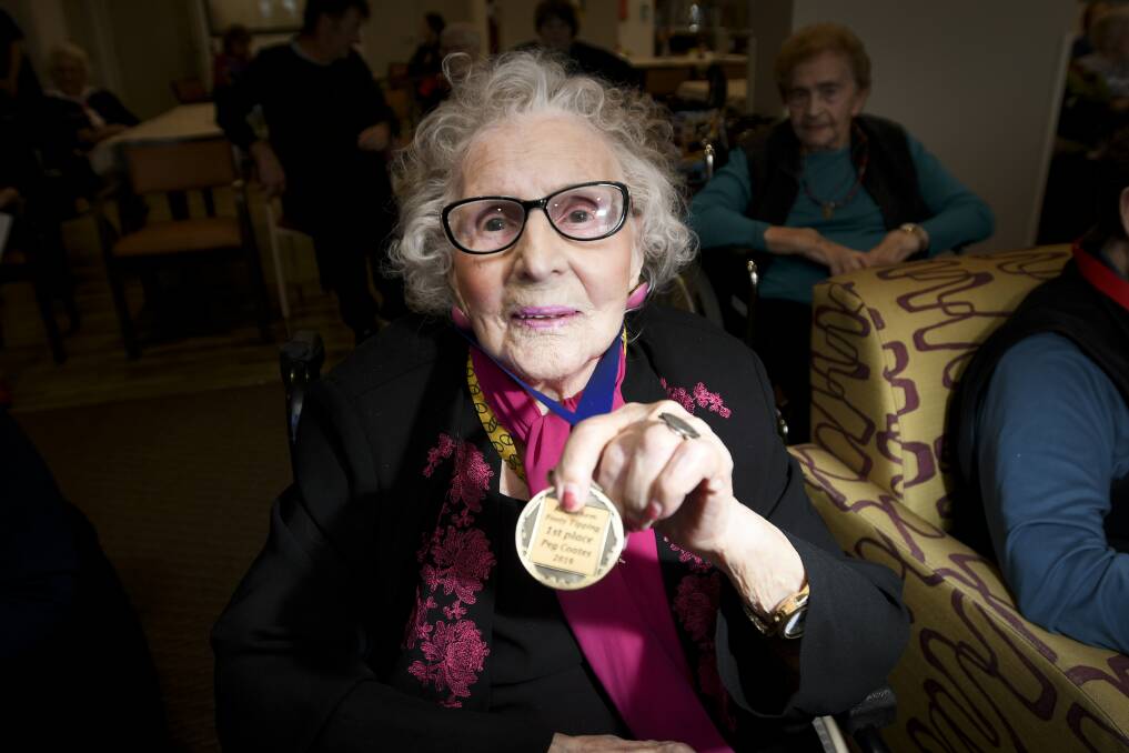 WINNER: Peg Coates (pictured here with her 2019 medal) has won her fifth-straight footy tipping competition. Picture: NONI HYETT