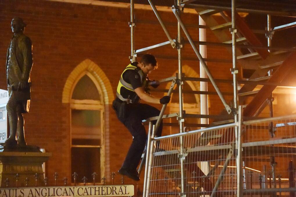 First Constable Richard Cairns is forced to climb scaffolding. Pictures: DARREN HOWE