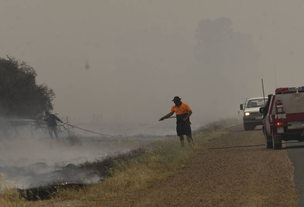 Members of the public help stop fires reigniting near Rochester. Picture: NONI HETT