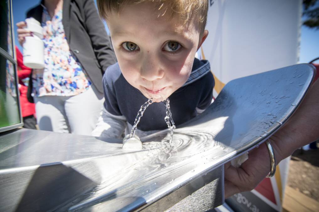 THIRSTY WORK: Sonny Barnes tries a new drinking fountain at Lake Weeroona's playground. Picture: DARREN HOWE