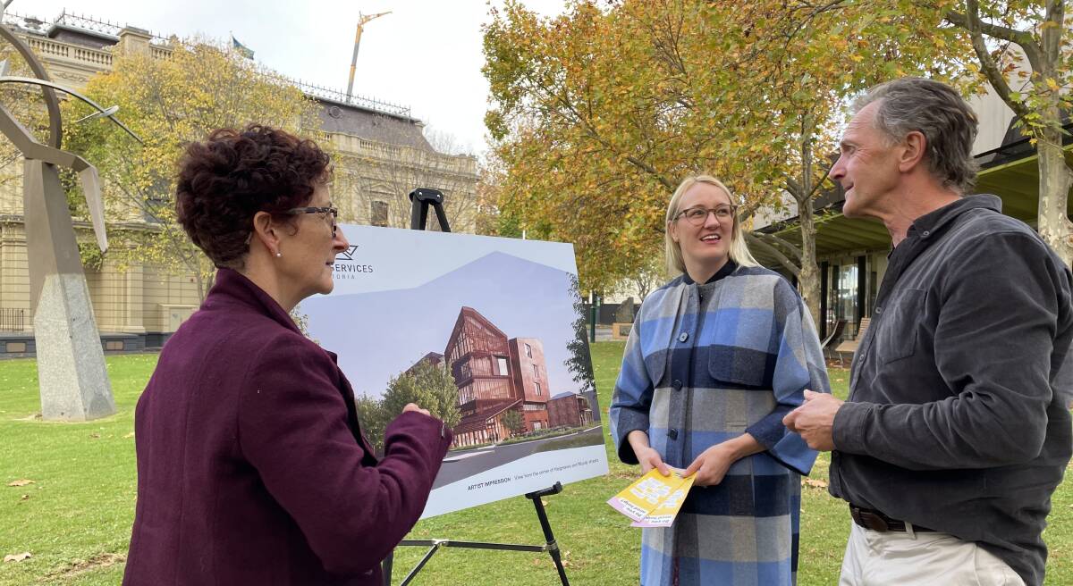 Court Services Victoria's Mick Carroll shows the Victoria Law Foundation's Lynne Haultain and Kate Sedgwick concept plans for the new Bendigo Law Courts. Picture: TOM O'CALLAGHAN
