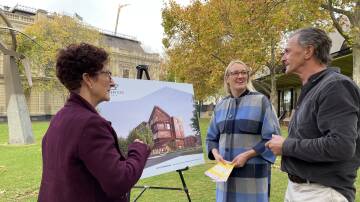 Court Services Victoria's Mick Carroll shows the Victoria Law Foundation's Lynne Haultain and Kate Sedgwick concept plans for the new Bendigo Law Courts. Picture: TOM O'CALLAGHAN