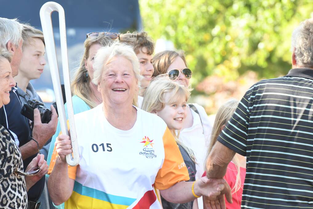 Lynn Walker with the queen's baton when it was relayed through Bendigo in 2018. Picture by Noni Hyett