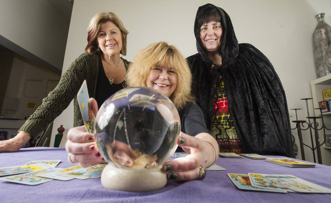 WITCHCRAFT LESSONS: Gaye Washington (centre) shows Bronwyn Griffith and Johanna Hobson the ins and outs of scrying. Picture: DARREN HOWE