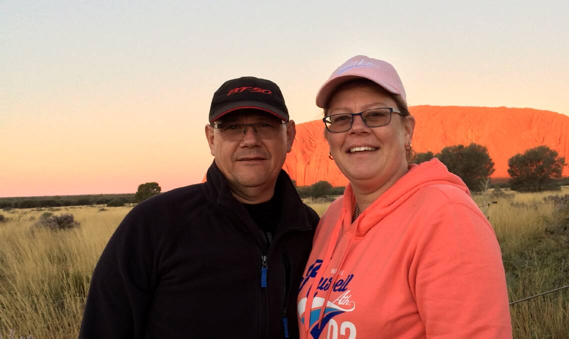 Graeme and Janine Holland pictured during a trip to Uluru. Picture: SUPPLIED
