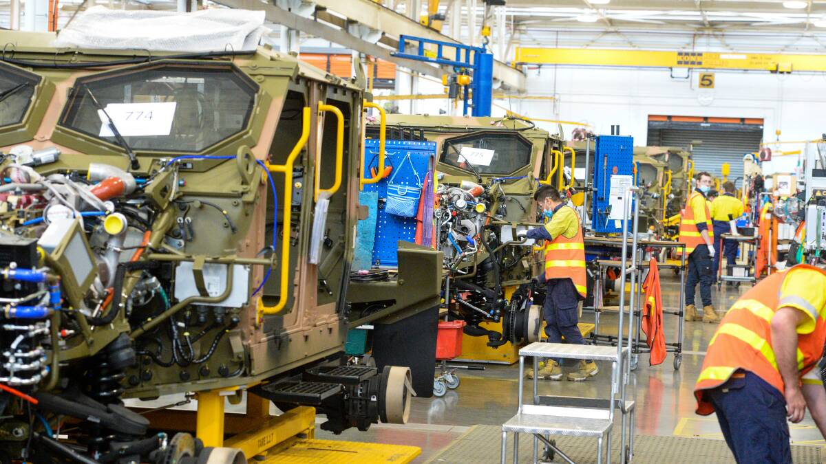 Thales workers on the production Bendigo line. Picture by Darren Howe