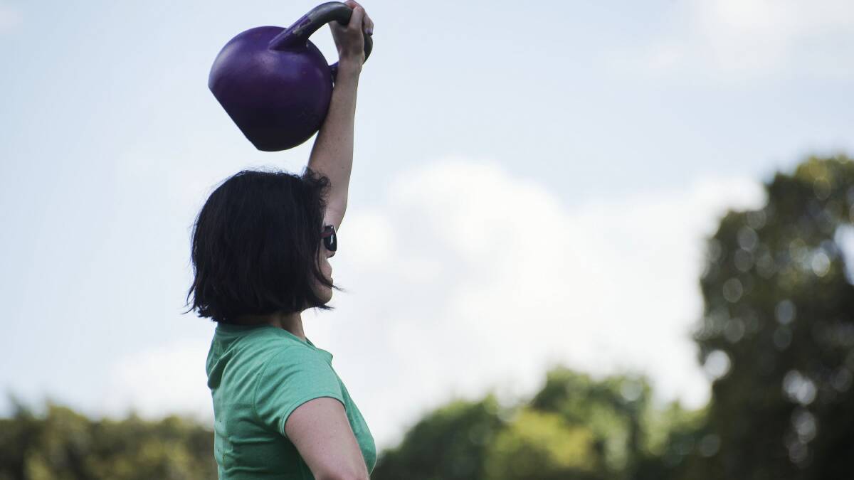 FIT AS A FIDDLE: A woman trains with a kettlebell at a Sydney exercise park. A researcher says seniors should have access to more exercise parks catering specifically to their needs. Picture: CHRISTOPHER PEARCE