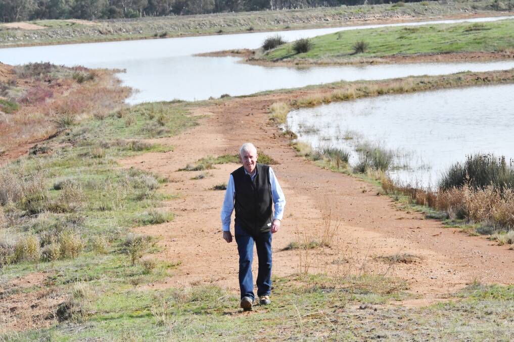 John Harrison inspects a Woodvale evaporation pond in 2019. Picture: DARREN HOWE