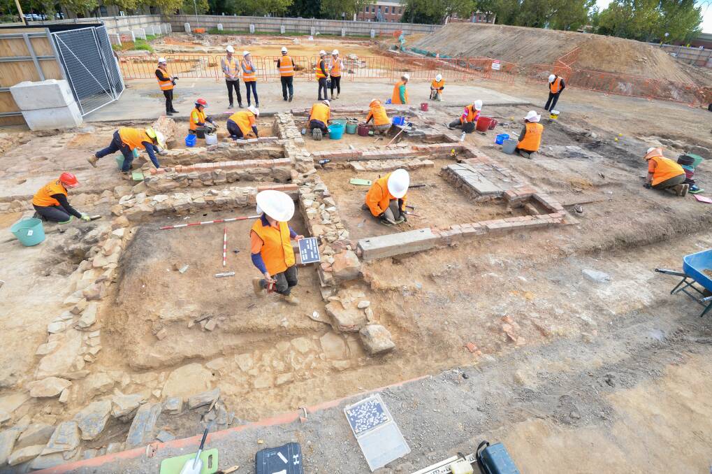 Archeologists working on once section of a wider govhub archeological site in Bendigo. Picture by Darren Howe.