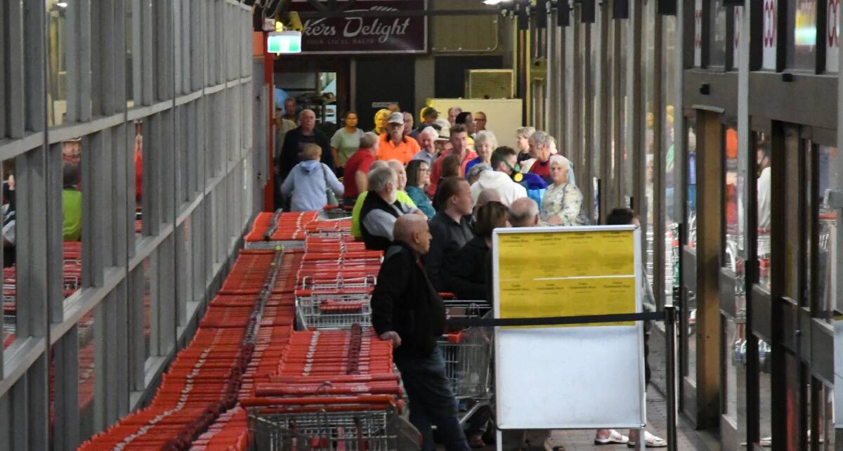 Customers line up ready for Coles' Bendigo store to open during the height of panic buying several weeks ago. Picture: TOM O'CALLAGHAN
