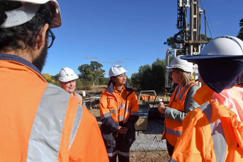 Games delivery minister Jacinta Allan joins drill workers and Bendigo mayor Andrea Metcalf speak with worker Gina Groenewald on on day one of geotechnical works at athletes' village site. Picture by Noni Hyett.