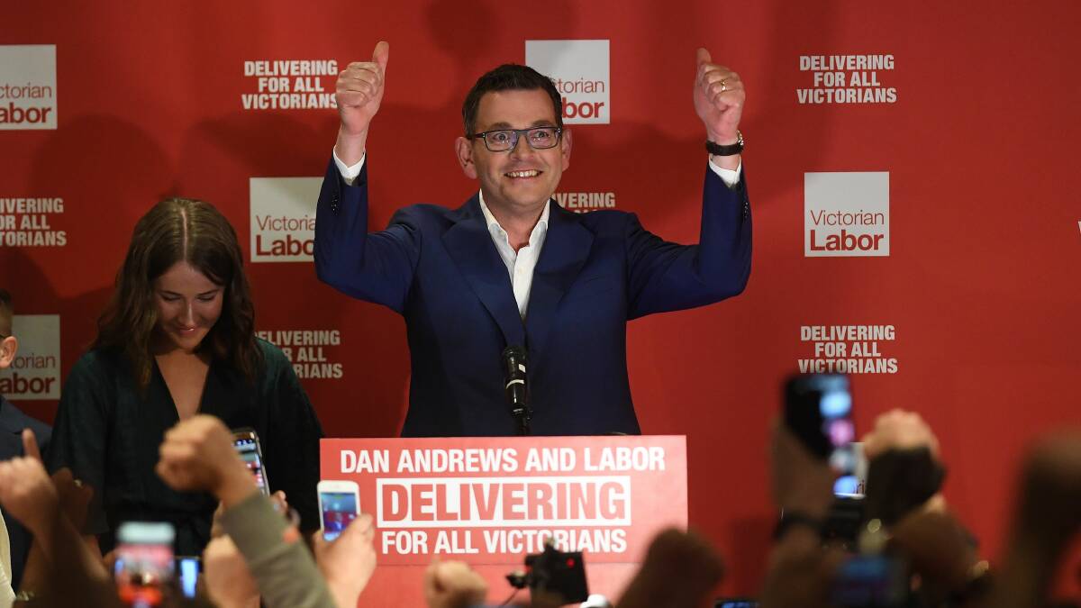 Winners are grinners: Daniel Andrews reacts as he arrives during the Labor Party reception at the Village Green in Mulgrave on Victorian State election night. Picture: Julian Smith, AAP