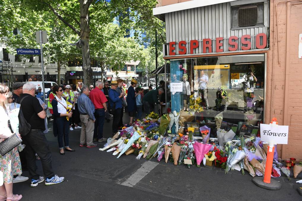 Victim mourned" People pay their respects to Sisto Malaspina, co-owner of Pellegrini's Espresso Bar, Bourke Street, Melbourne. Mr Malaspina was the victim of Friday's terror incident. (James Ross, AAP)
