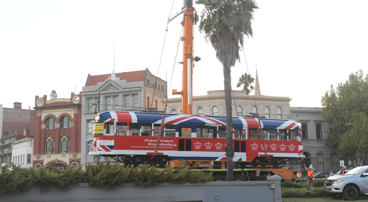 Tram of Hope and Glory: The pop-cup cafe being lowered into place near Rosalinda Park. Picture: NONI HYETT