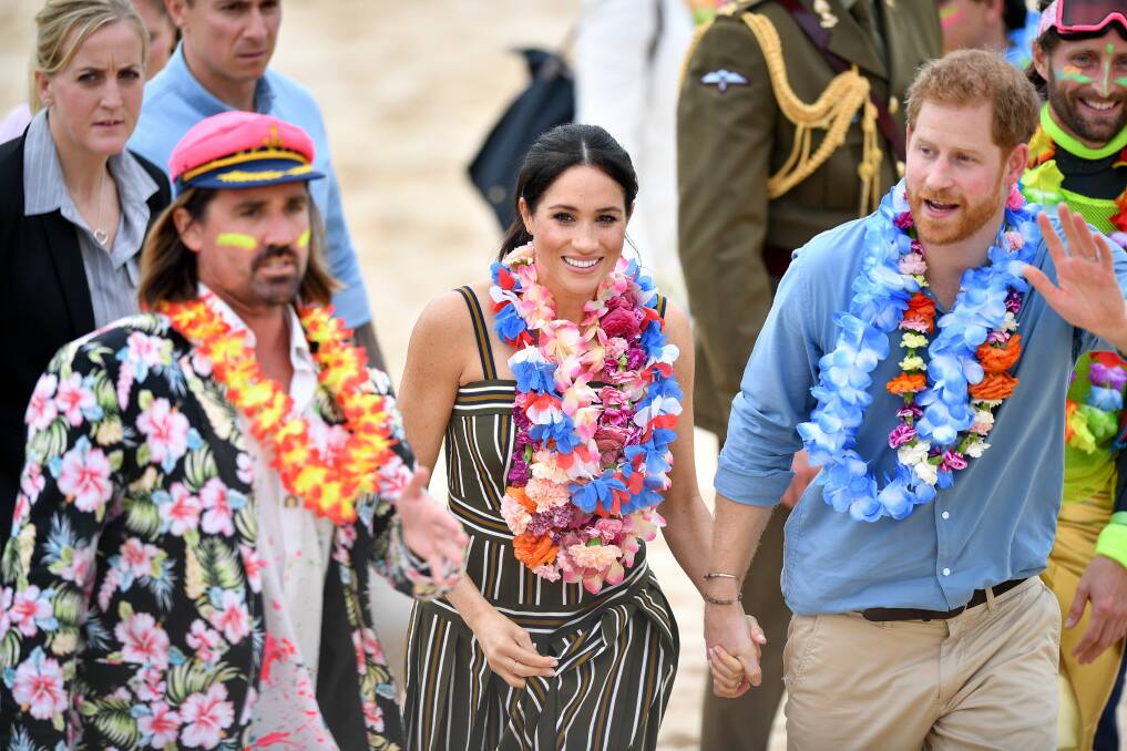 Bondia beach walk: Meghan and Harry in Sydney. Picture: AAP
