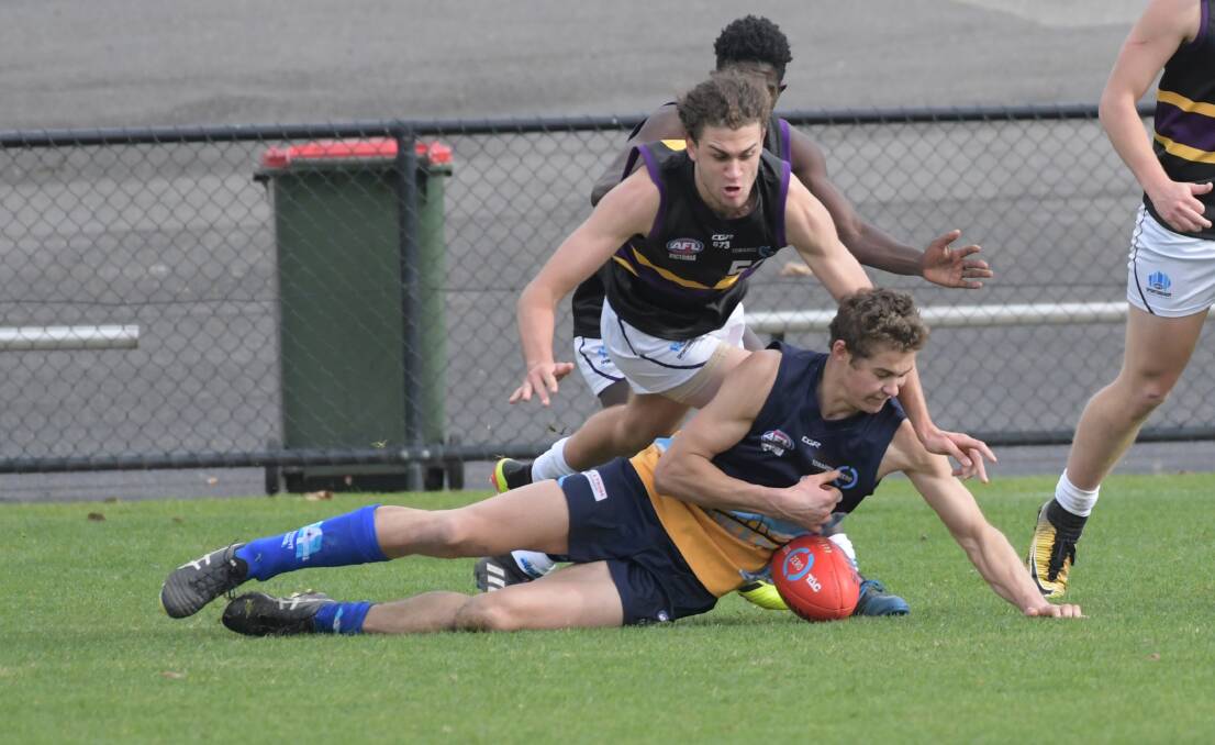 QEO action: Games were played on Sunday at the ground in wet conditions. Picture: Noni Hyett