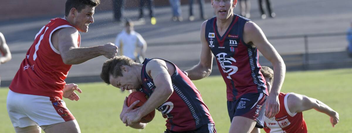 Brady Childs makes high contact with Lee Coghlan. Picture: NONI HYETT