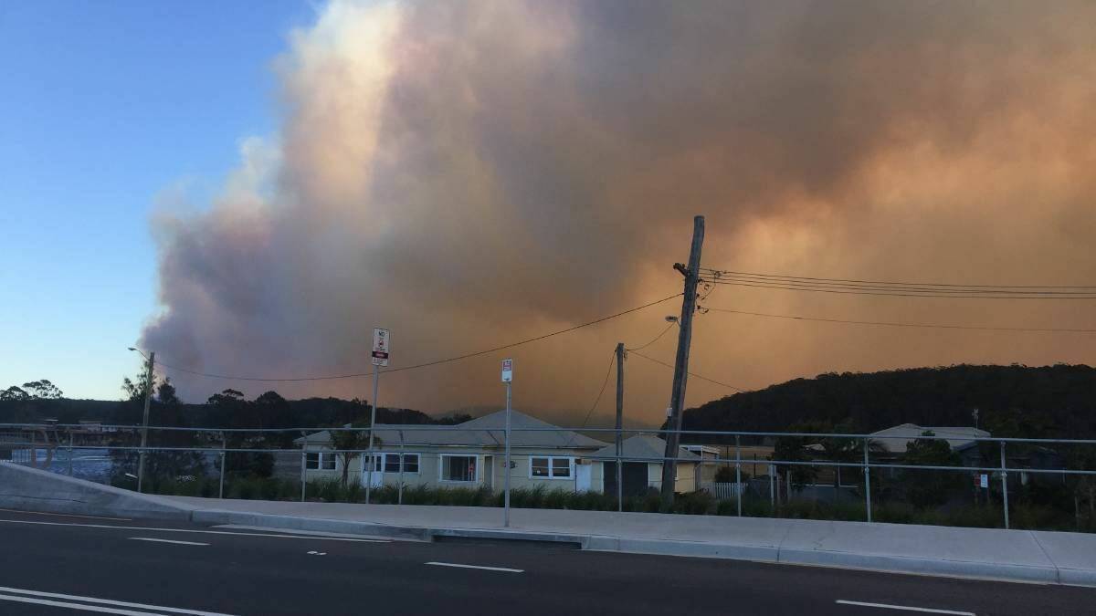 Under threat: the fire front approaches Milton, on the New South Wales south coast August 15. Picture: Milton Ulladulla Times